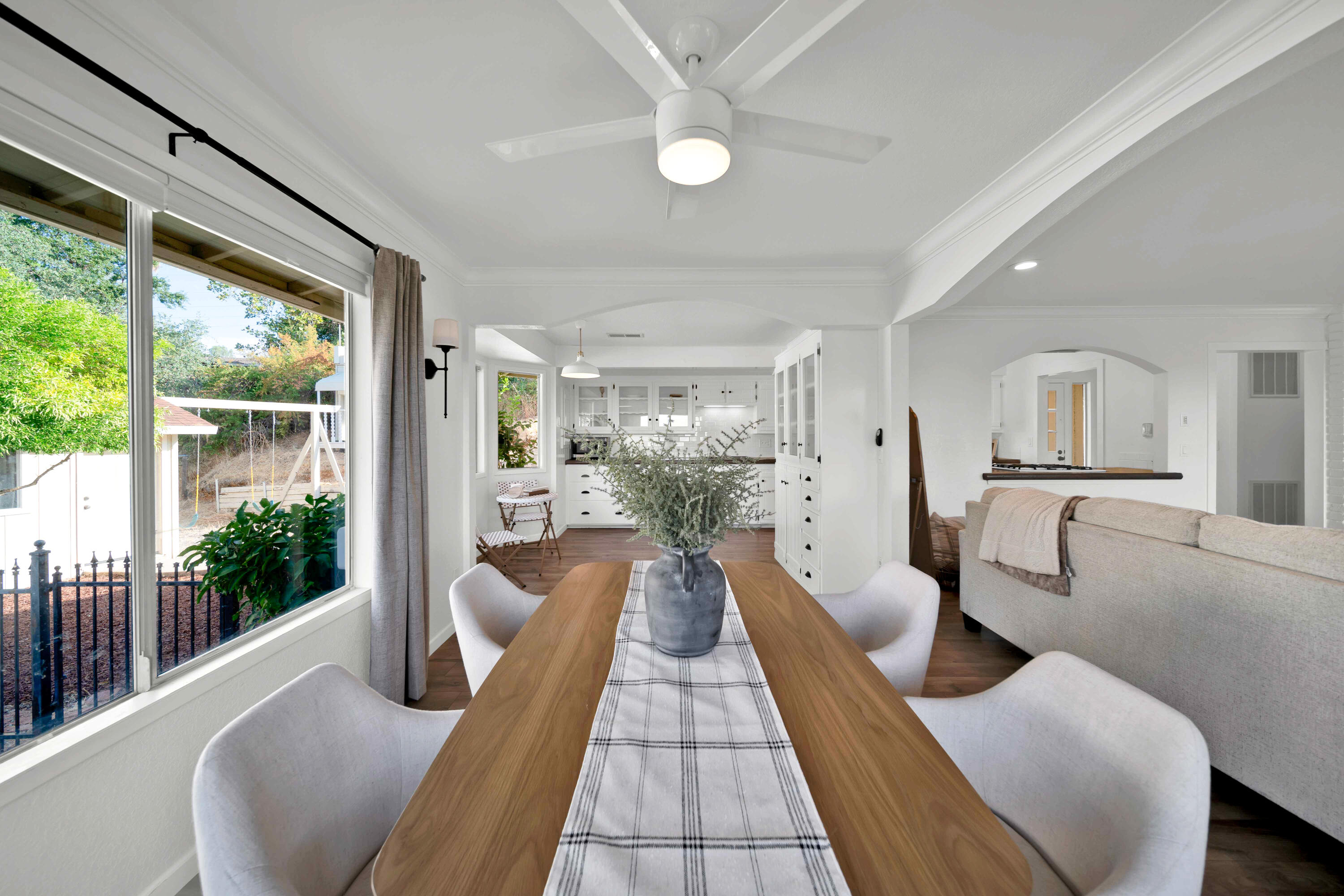 1705 Barbara Road Redding, CA 96003 - Photo 54 of 103 a view of a living room and kitchen with furniture wooden floor