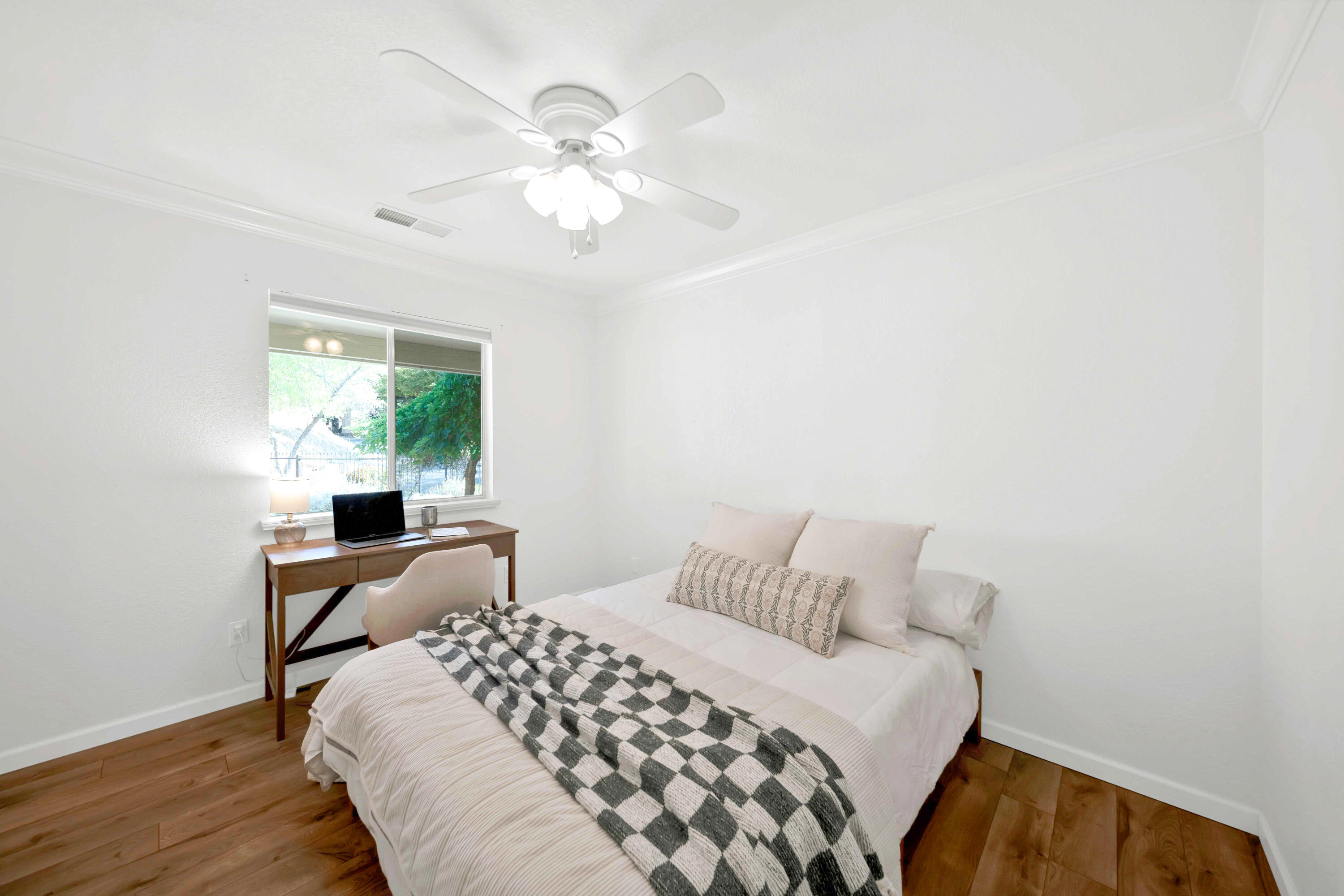 1705 Barbara Road Redding, CA 96003 - Photo 59 of 103 a bedroom with a bed and a chandelier