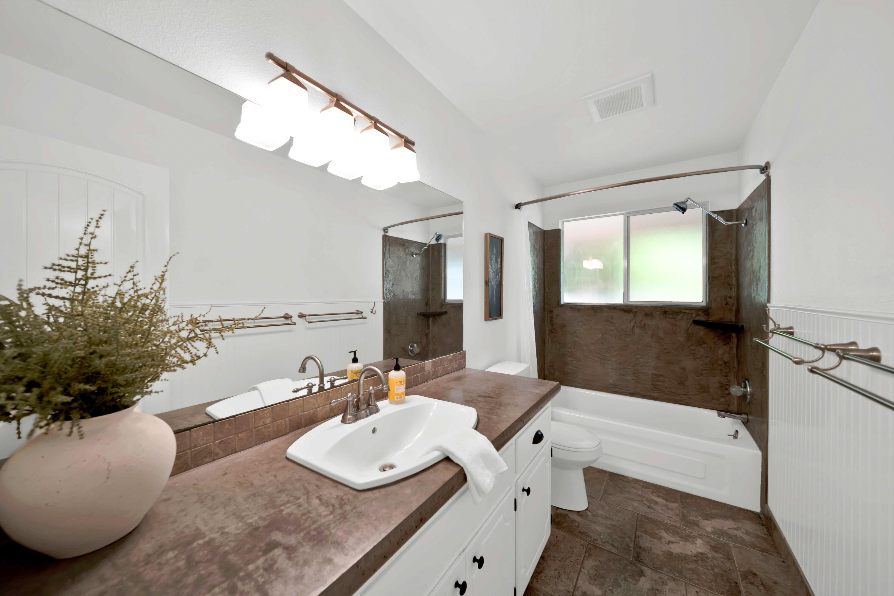 1705 Barbara Road Redding, CA 96003 - Photo 60 of 103 a bathroom with a sink and a mirror
