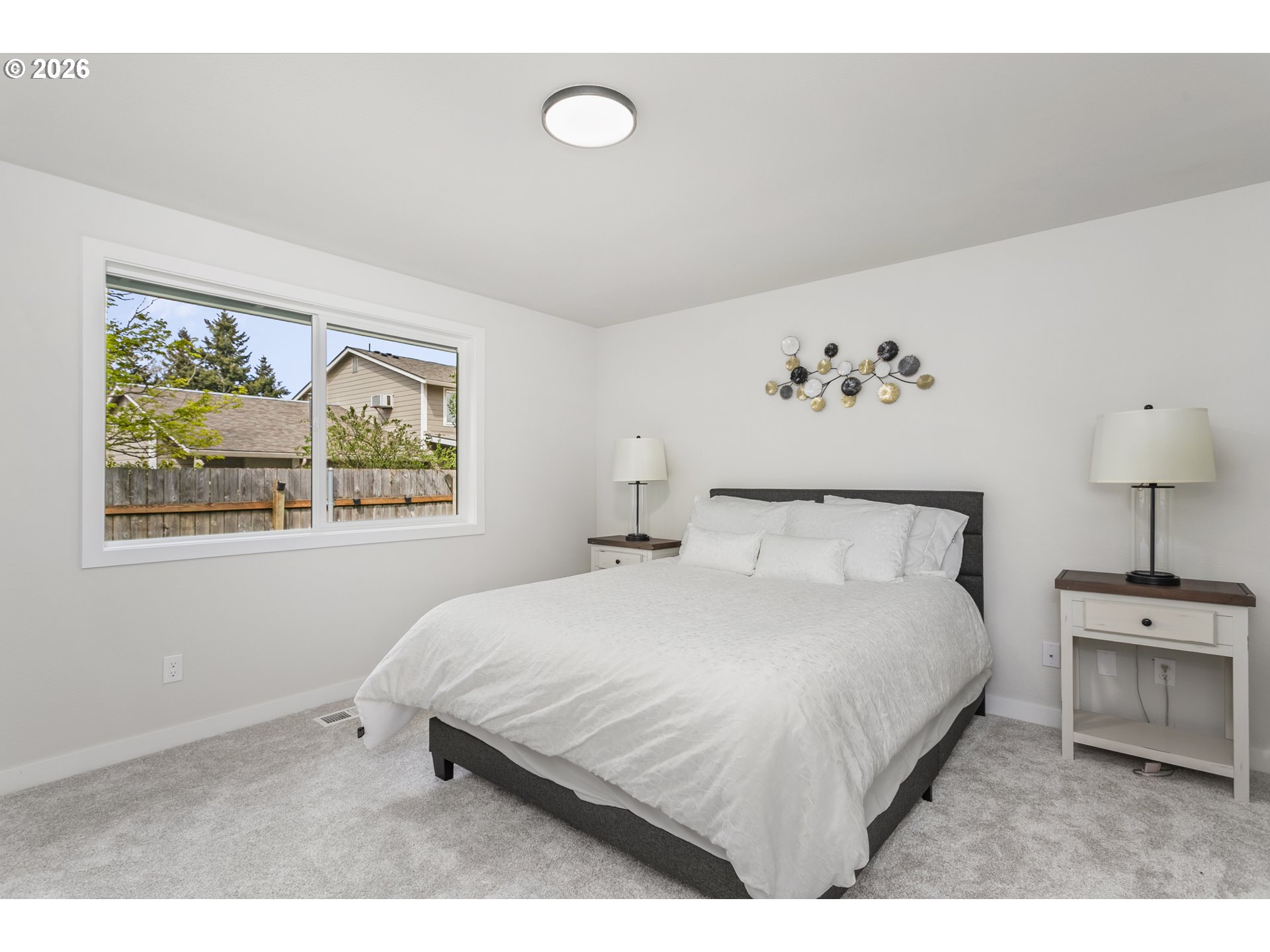 174 Southwest 10th Avenue Canby, OR 97013 - Photo 17 of 31 a bedroom with a bed and a painting on the wall