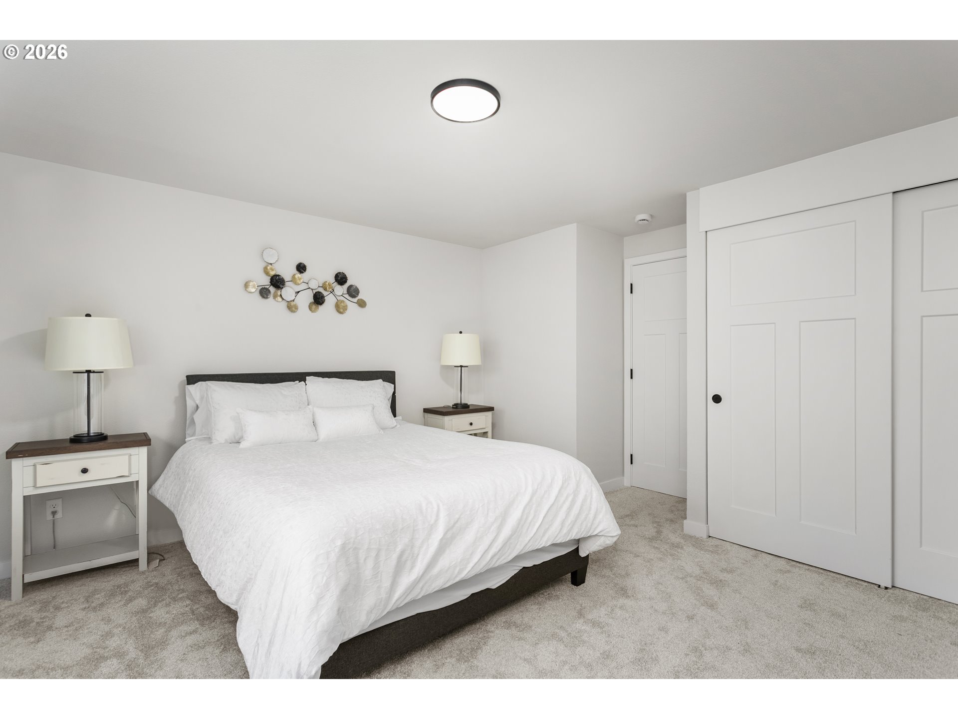 174 Southwest 10th Avenue Canby, OR 97013 - Photo 18 of 31 a bedroom with a bed and a painting