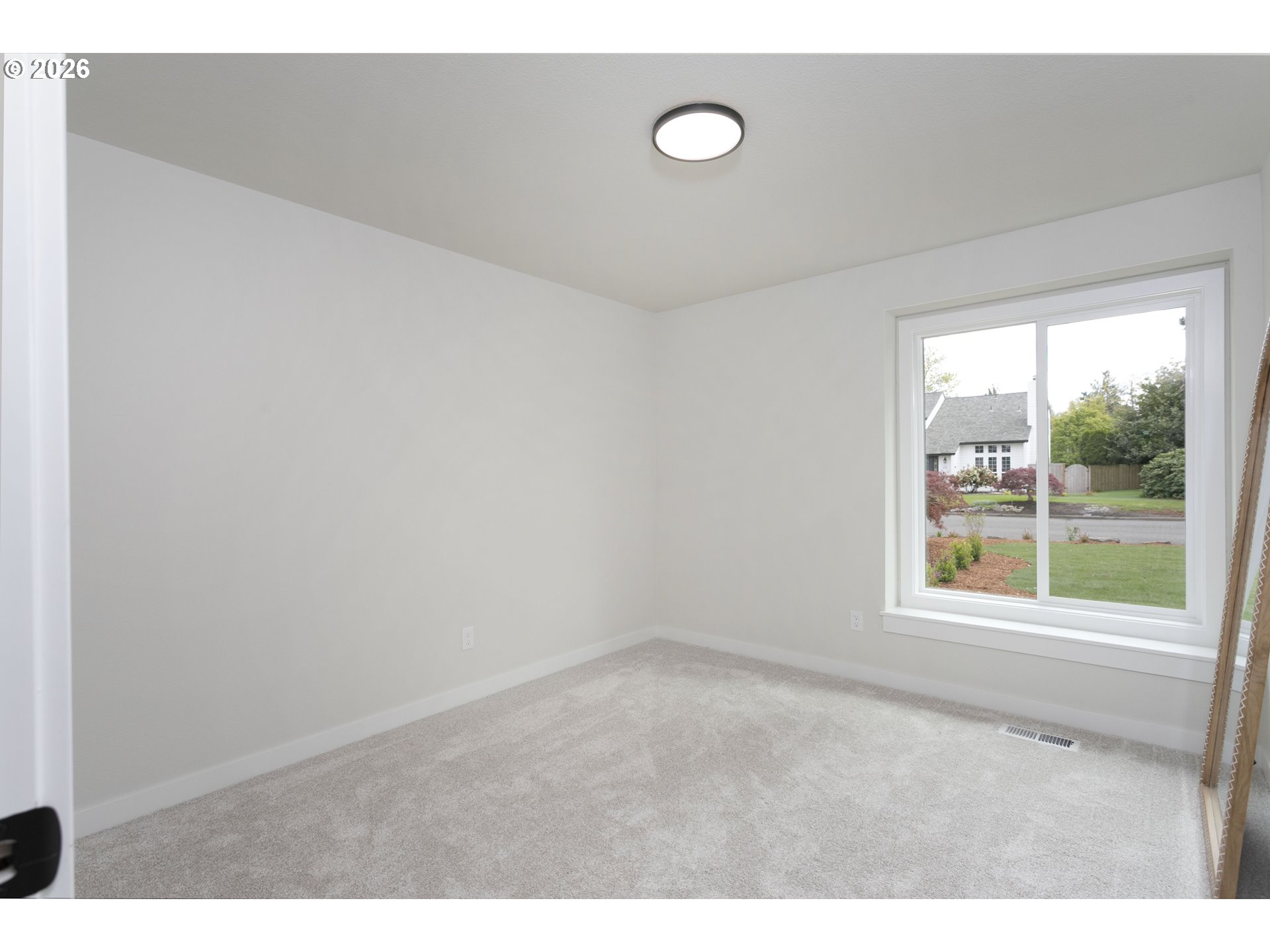 174 Southwest 10th Avenue Canby, OR 97013 - Photo 23 of 31 a view of an empty room with a window