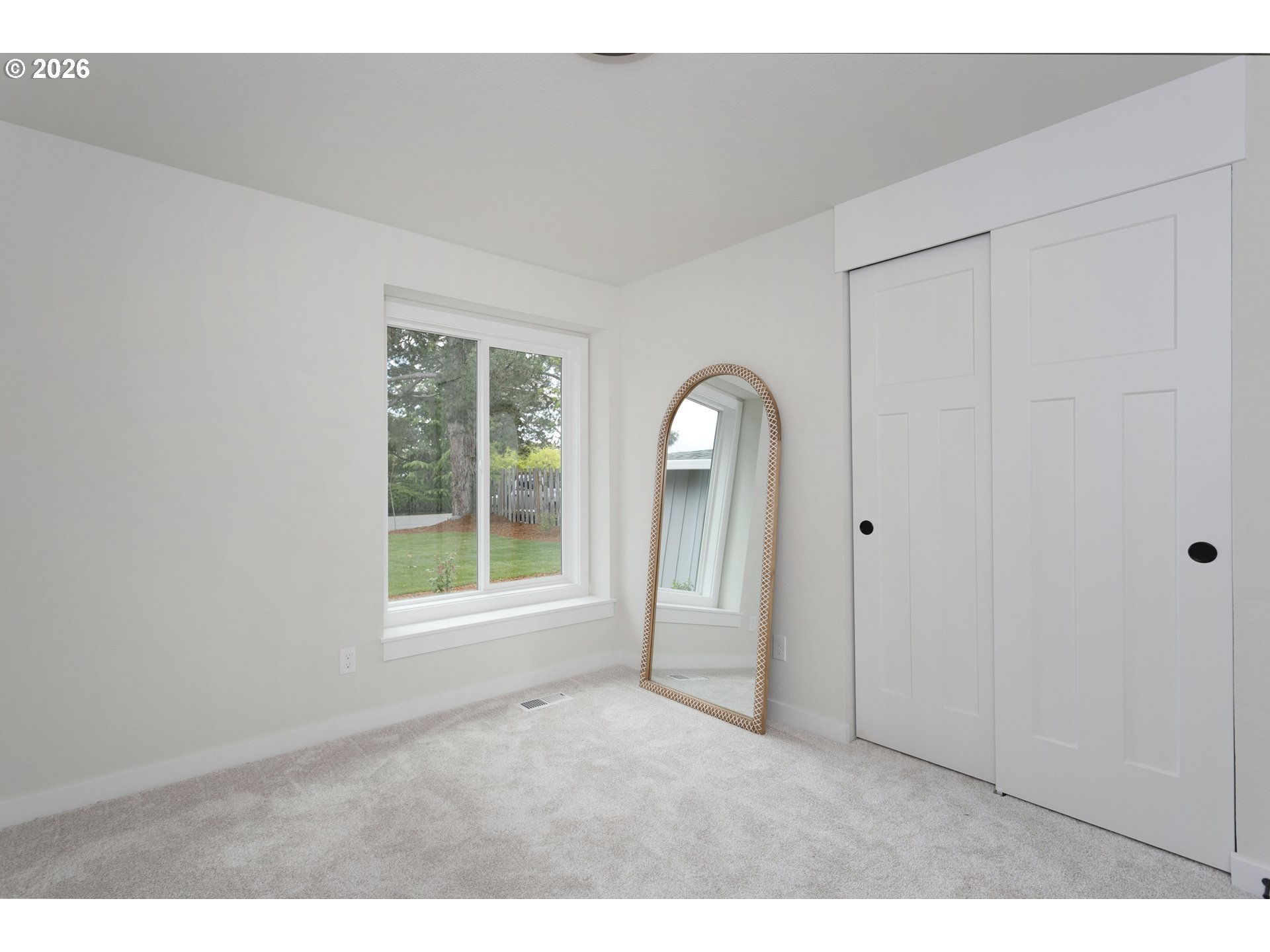 174 Southwest 10th Avenue Canby, OR 97013 - Photo 24 of 31 a view of an empty room with a window