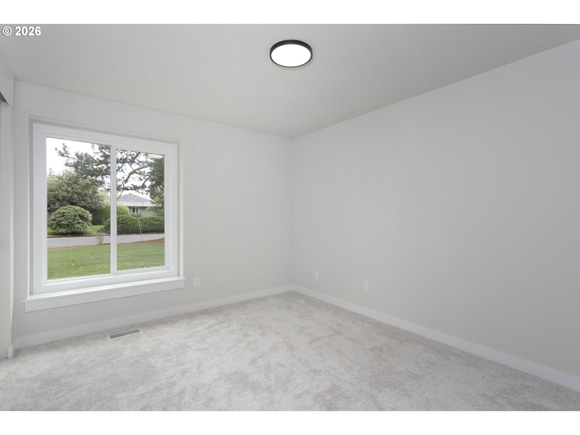 174 Southwest 10th Avenue Canby, OR 97013 - Photo 25 of 31 a view of an empty room with a window
