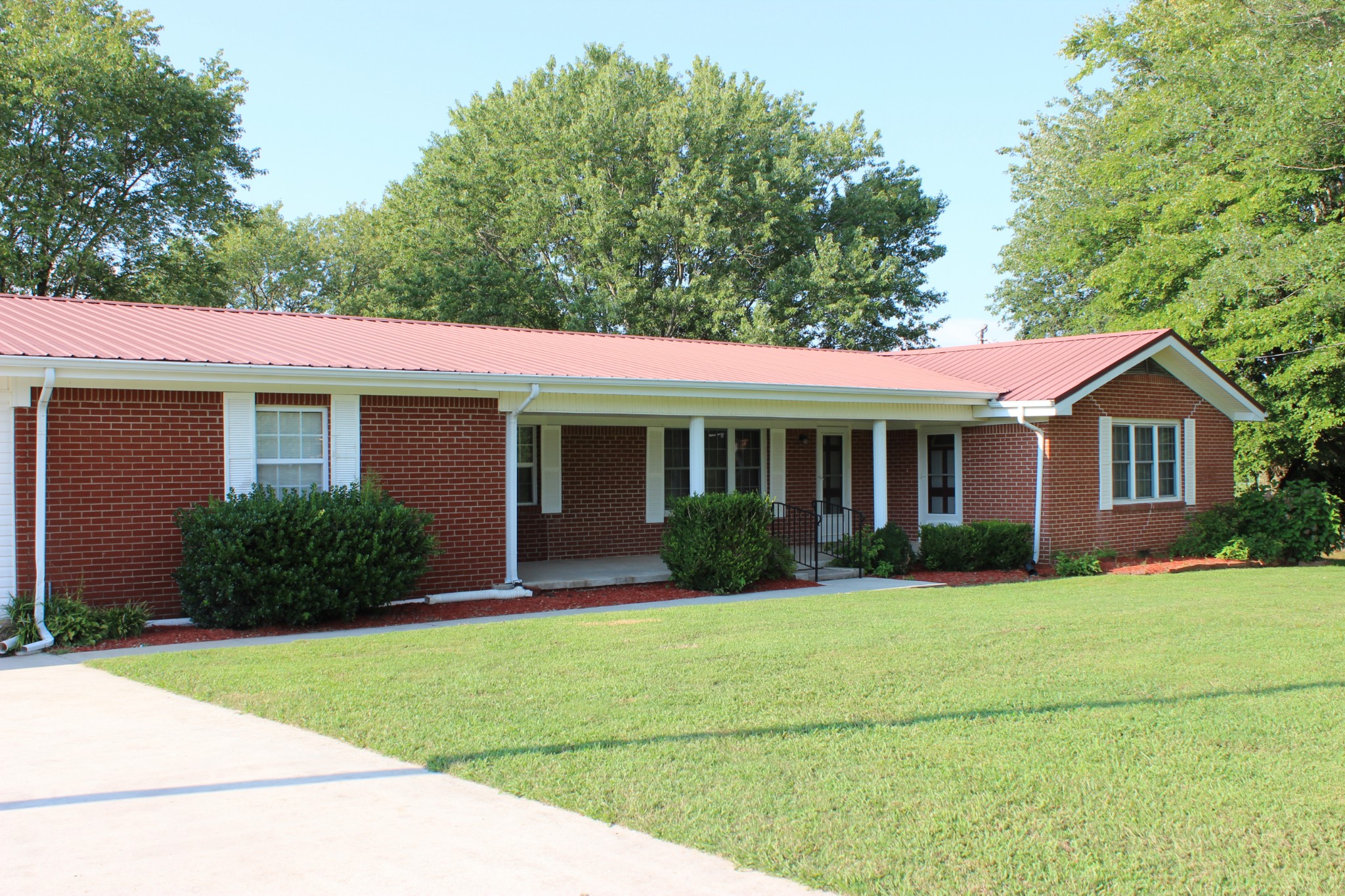 512 Limestone Road Elora, TN 37328 - Photo 2 of 44 a front view of a house with a yard and garage