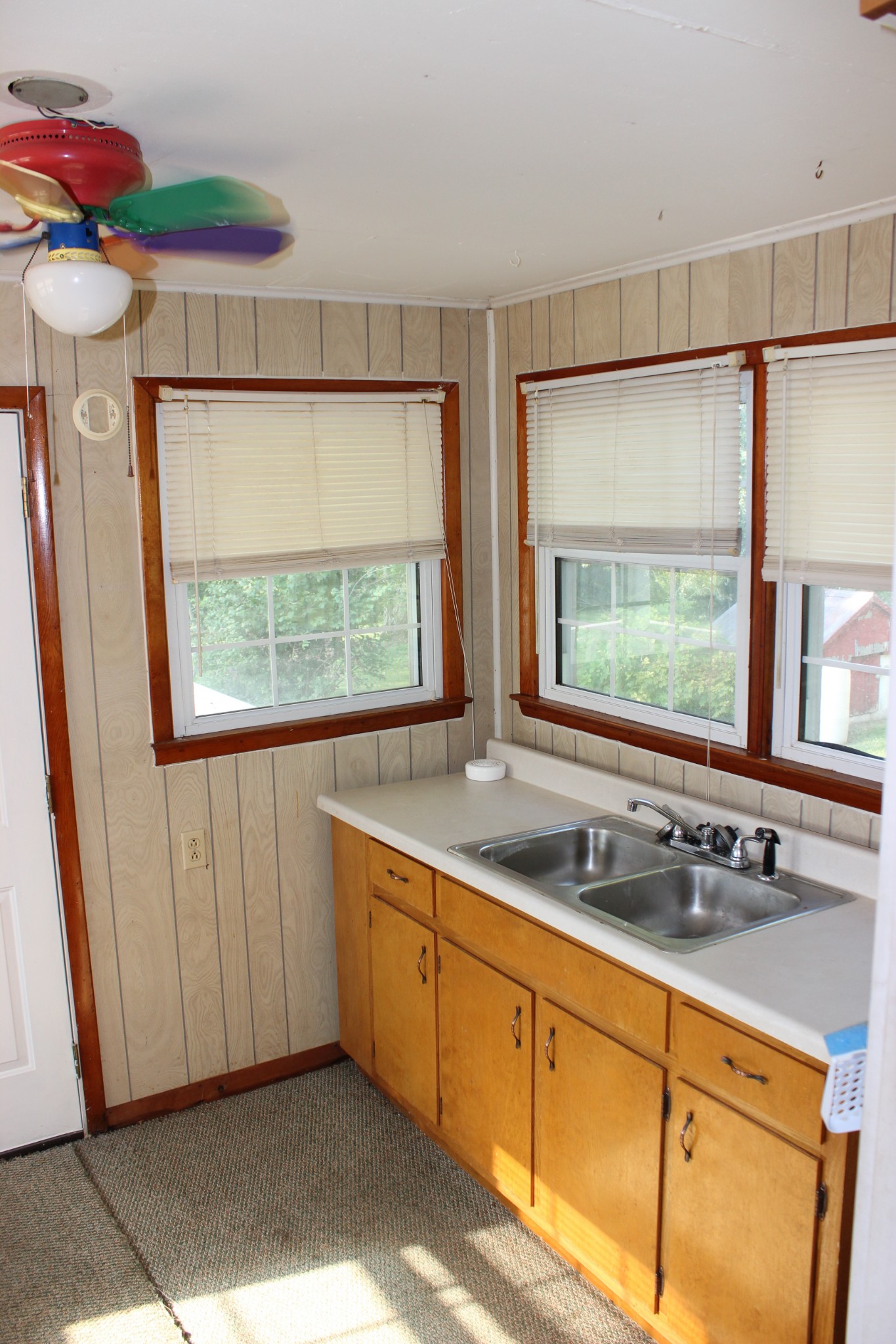 512 Limestone Road Elora, TN 37328 - Photo 13 of 44 a kitchen with stainless steel appliances a sink a window and cabinets