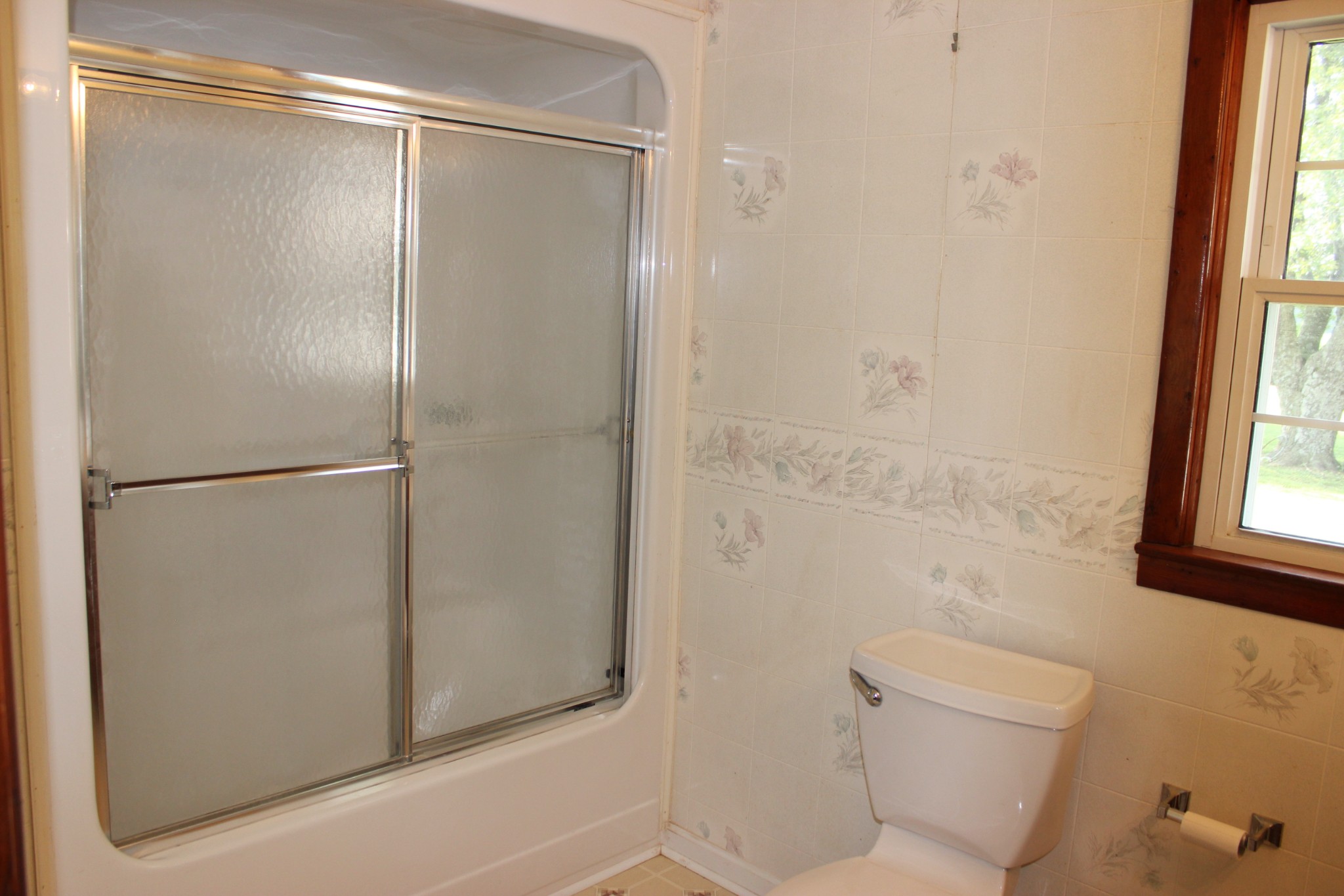 512 Limestone Road Elora, TN 37328 - Photo 16 of 44 a bathroom with a glass shower door