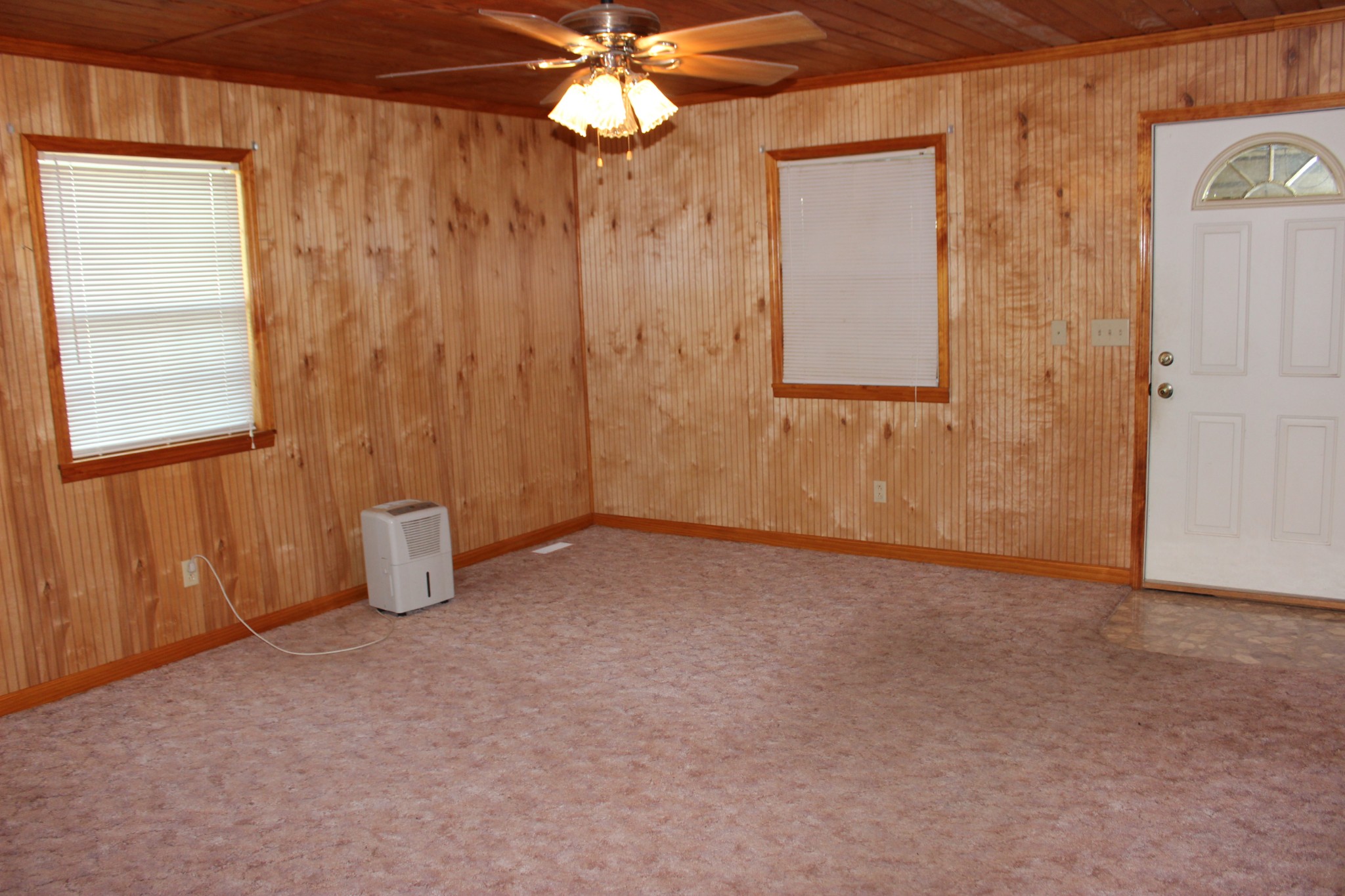 512 Limestone Road Elora, TN 37328 - Photo 20 of 44 an empty room with windows and fan