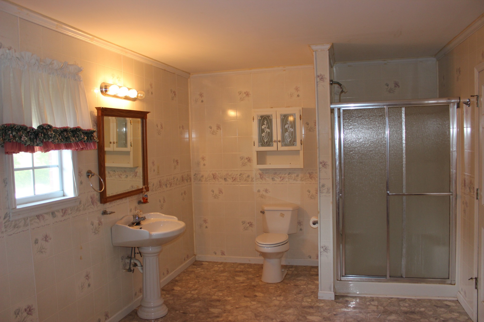 512 Limestone Road Elora, TN 37328 - Photo 24 of 44 a bathroom with a toilet sink and mirror