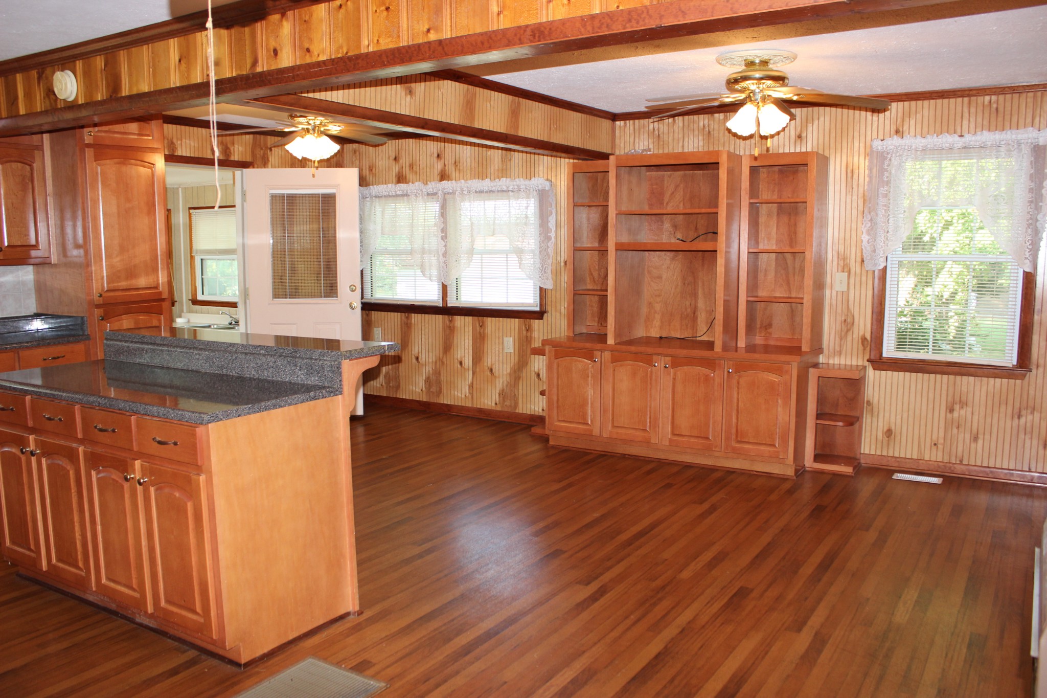 512 Limestone Road Elora, TN 37328 - Photo 4 of 44 a view of a room with wooden floor and cabinet