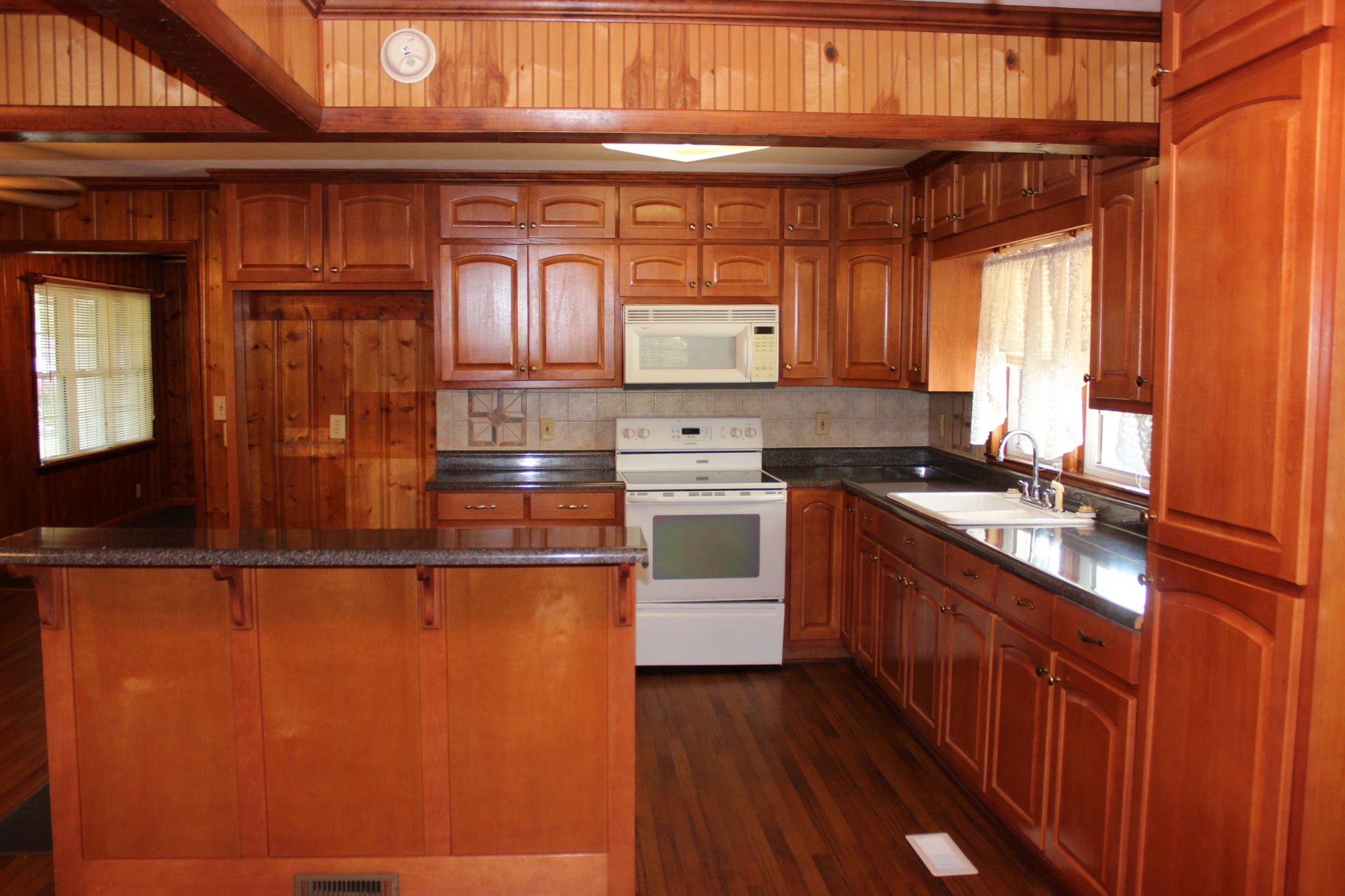 512 Limestone Road Elora, TN 37328 - Photo 5 of 44 a kitchen with stainless steel appliances granite countertop a stove a sink and dishwasher