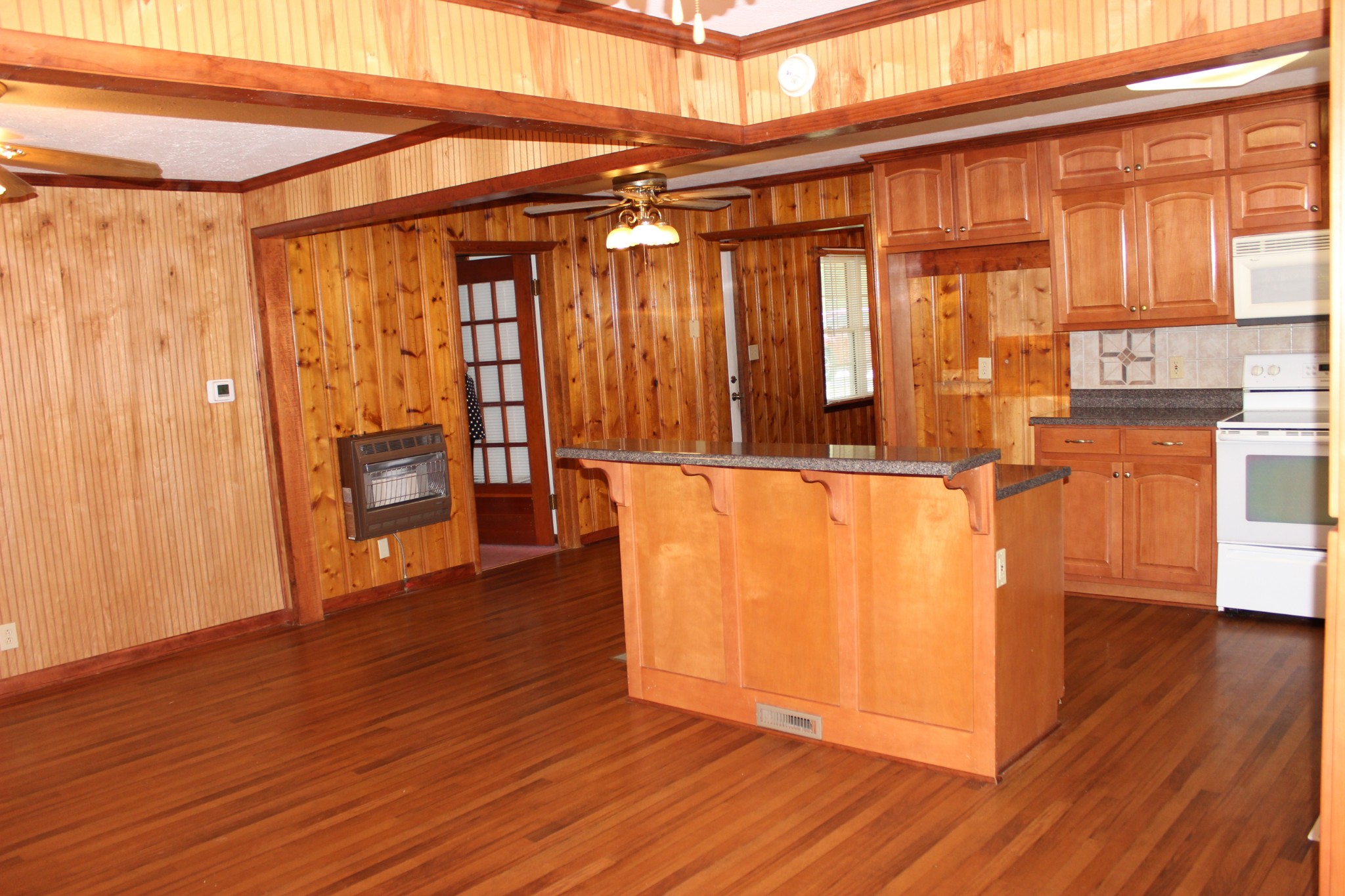 512 Limestone Road Elora, TN 37328 - Photo 6 of 44 a view of a refrigerator in kitchen and wooden floor