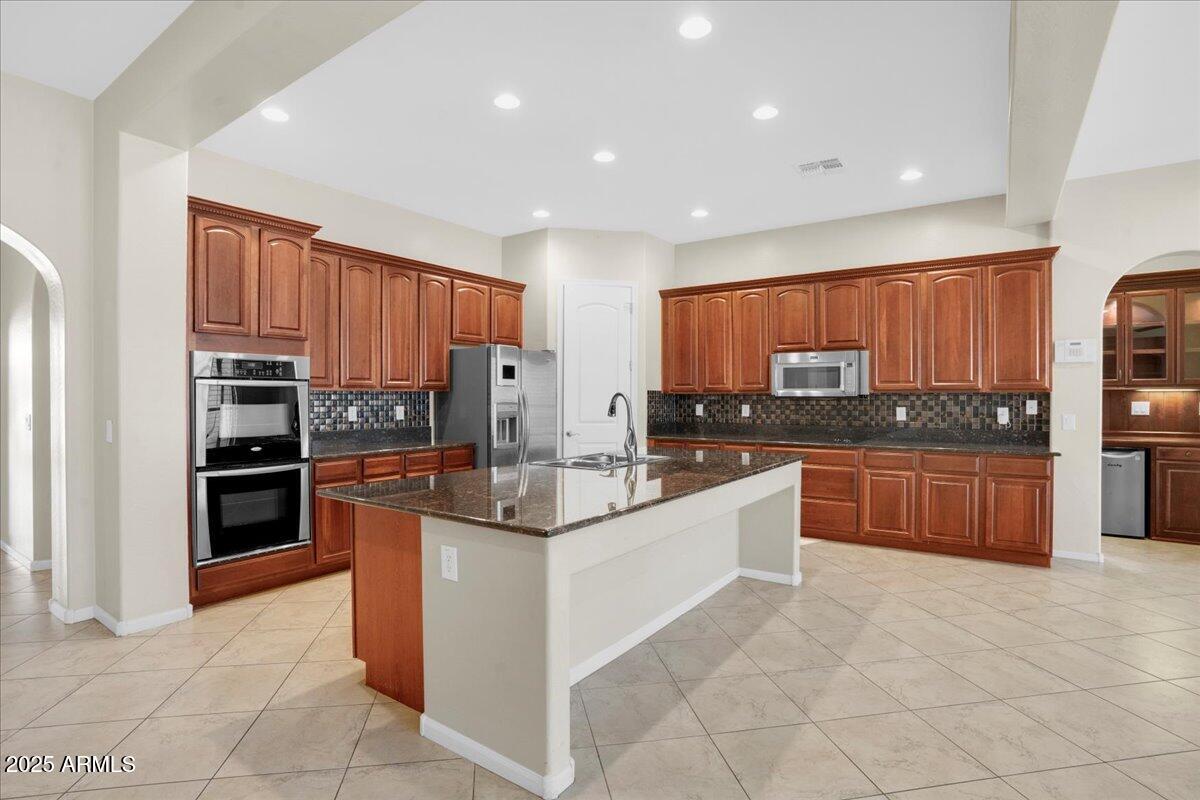2410 East Park View Lane Phoenix, AZ 85024 - Photo 3 of 15 a large kitchen with stainless steel appliances and cabinets