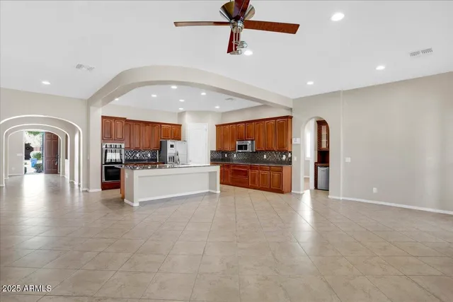 a view of kitchen with cabinets and stainless steel appliances