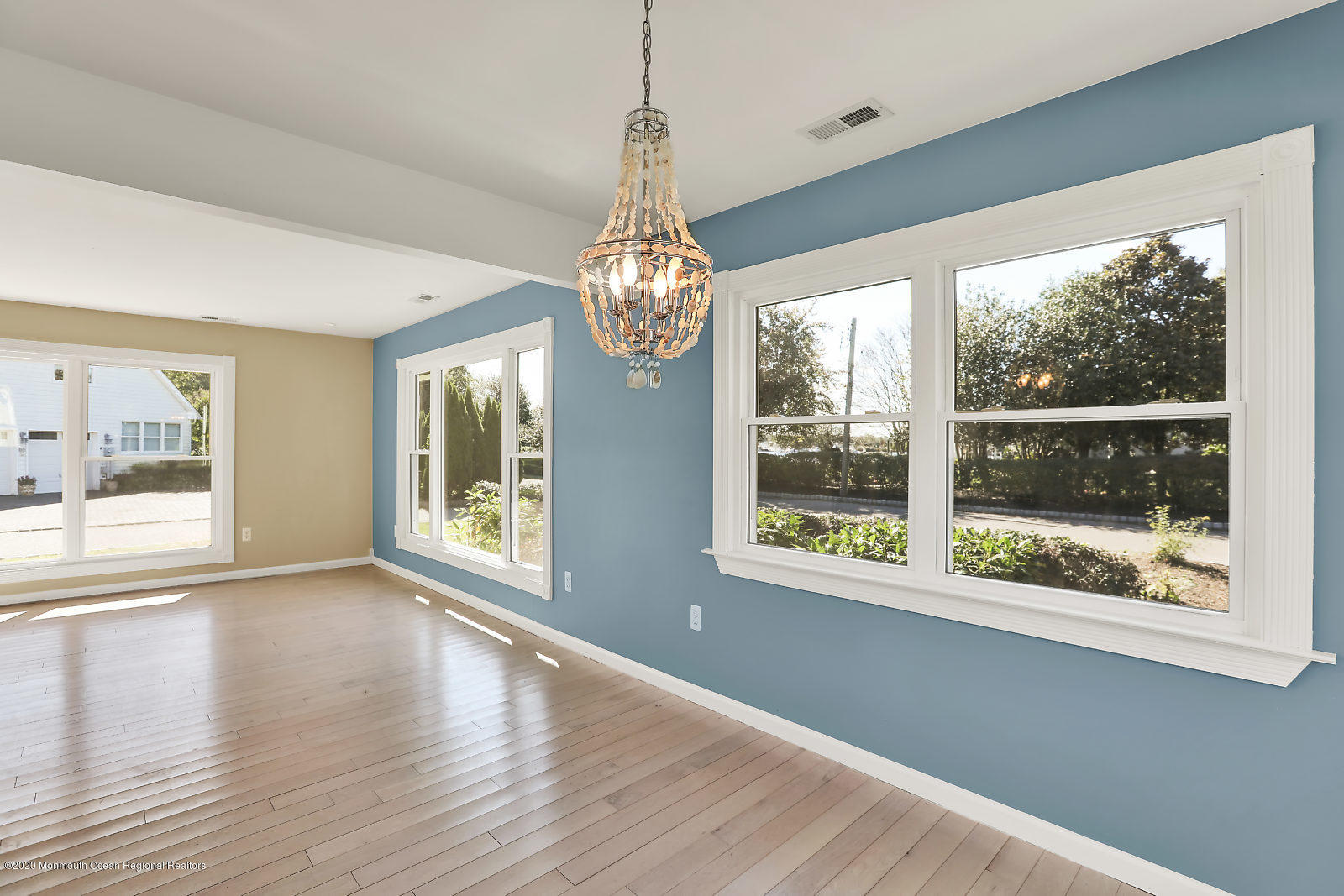90 Flag Point Road Toms River, NJ 08753 - Photo 8 of 24 a view of an empty room with wooden floor and a window