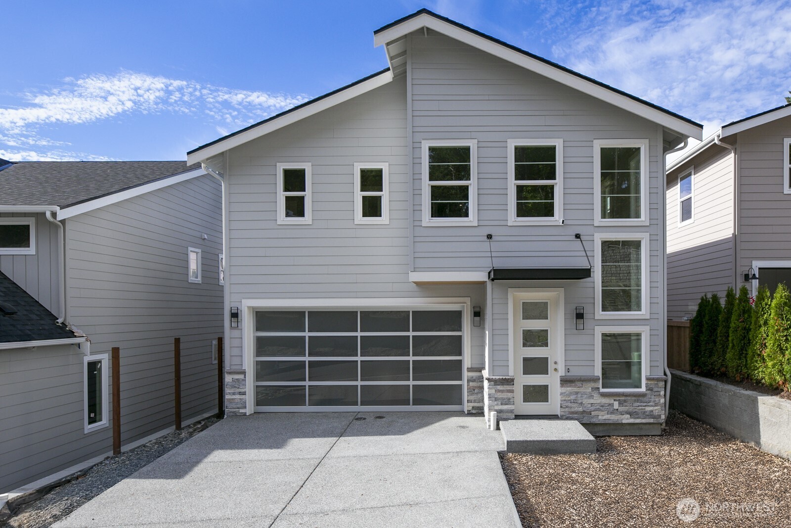 a front view of a house with a large window