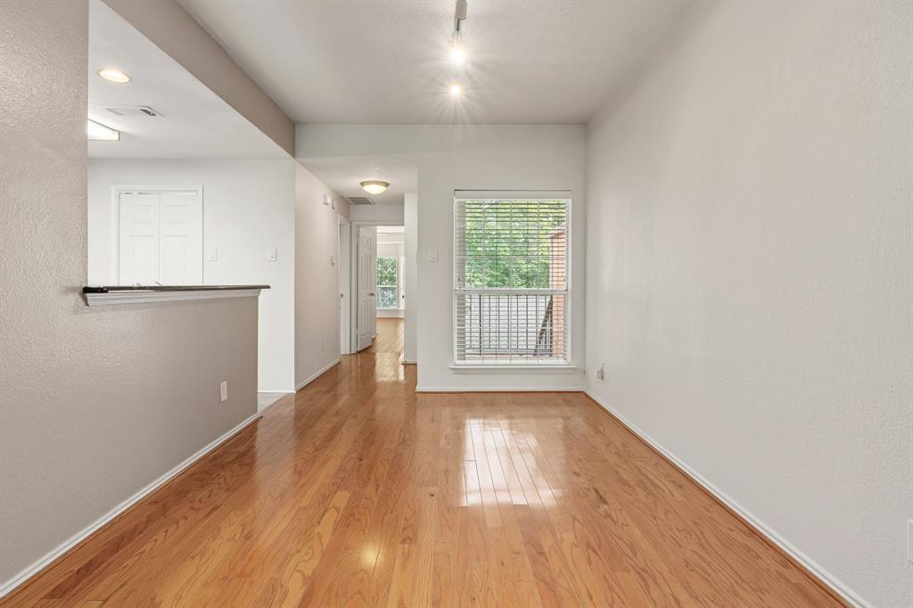12660 Hillcrest Road, Unit 4203 Dallas, TX 75230 - Photo 3 of 16 Empty room with light hardwood / wood-style flooring