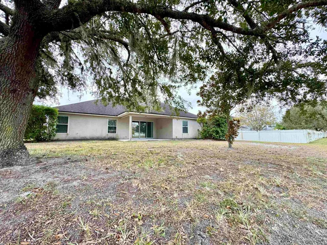 a view of a lake with houses in the back