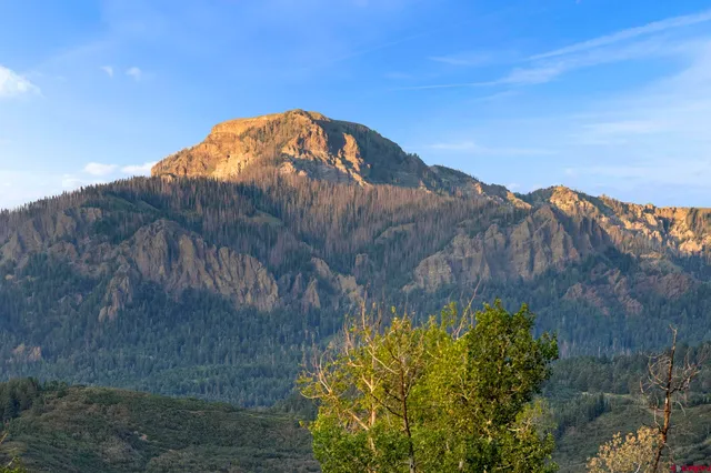 a bathroom with a double vanity sink and a window