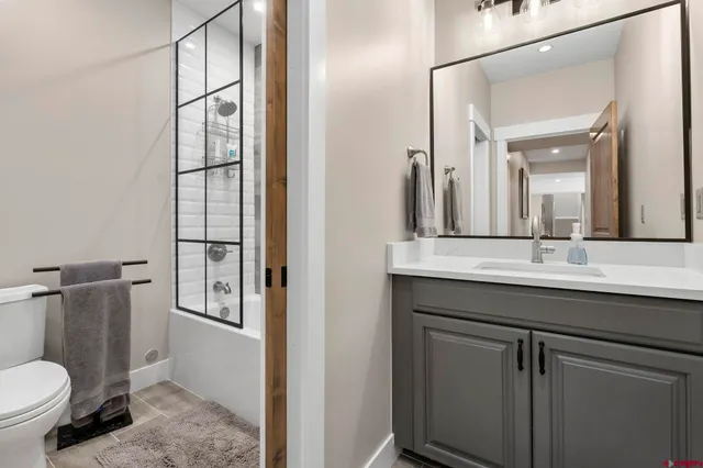 a bath tub sitting next to a window