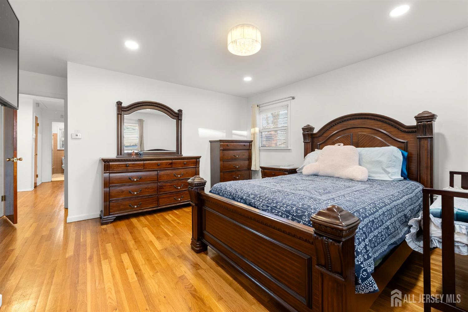 2291 Morrison Avenue Union, NJ 07083 - Photo 12 of 28 a bedroom with a bed and a dresser