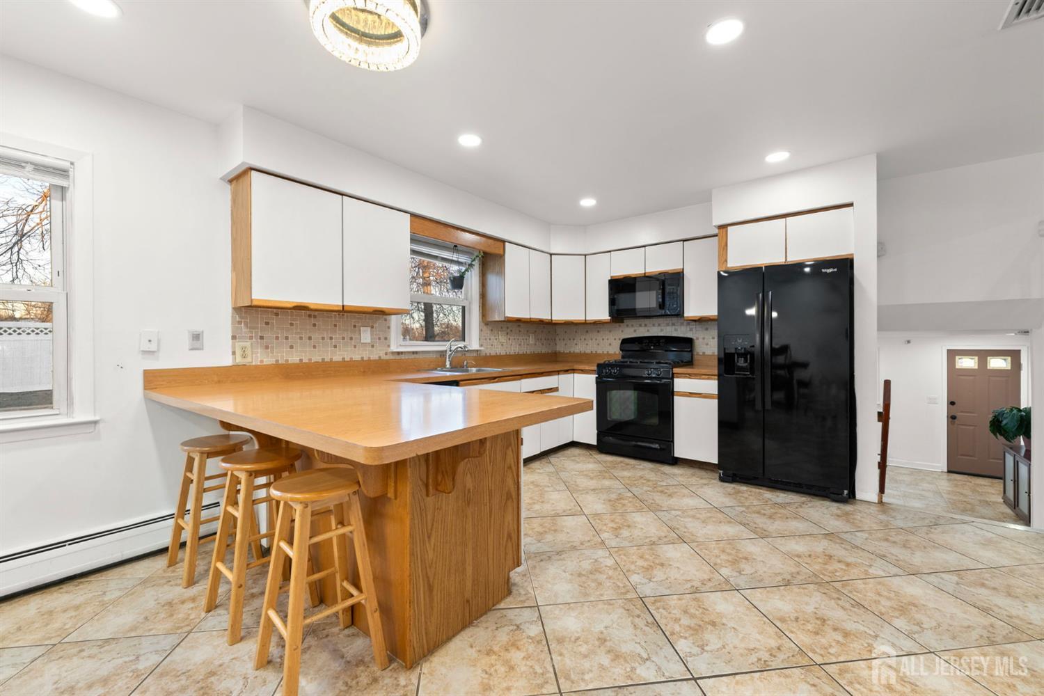 2291 Morrison Avenue Union, NJ 07083 - Photo 10 of 28 a kitchen with a sink a counter space stainless steel appliances cabinets and a window
