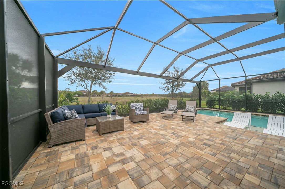 a view of swimming pool with a patio
