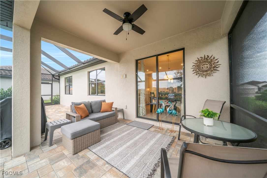 19918 Beverly Park Road Estero, FL 33928 - Photo 17 of 46 a living room with furniture and a large window