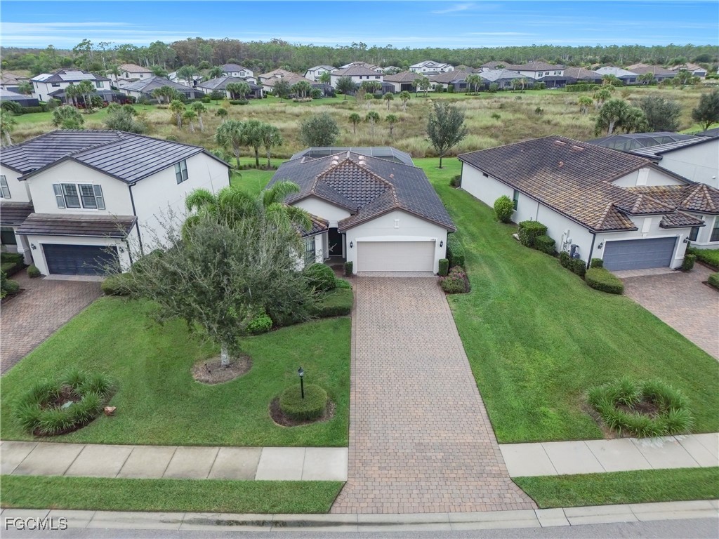 19918 Beverly Park Road Estero, FL 33928 - Photo 2 of 46 an aerial view of a house with garden