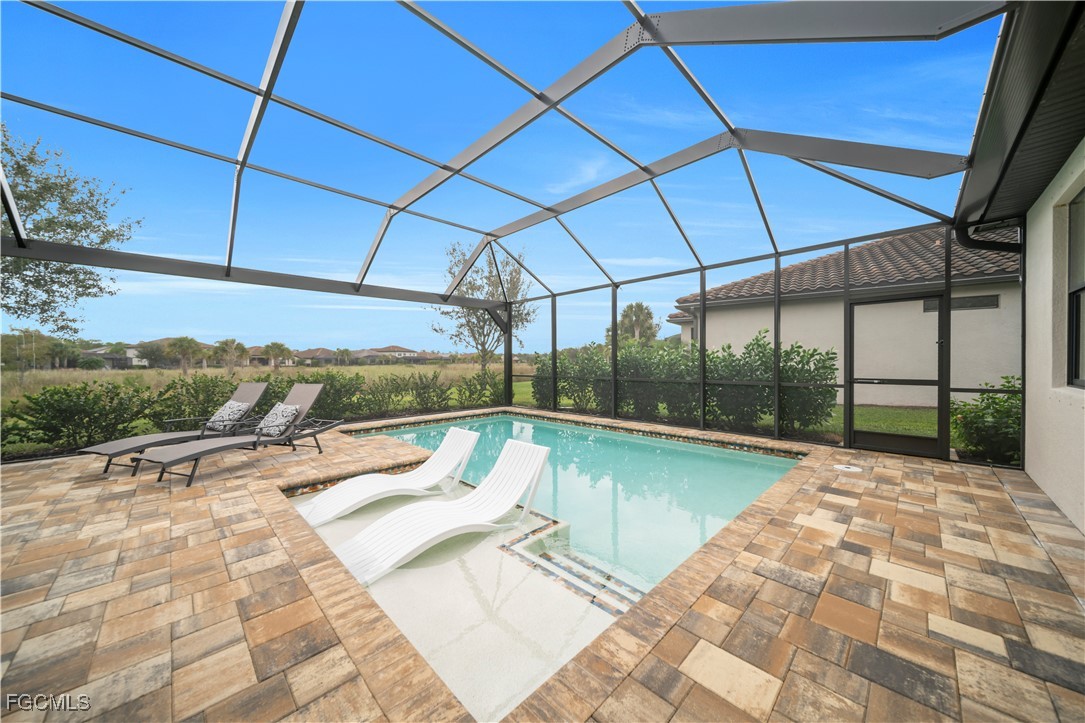 19918 Beverly Park Road Estero, FL 33928 - Photo 23 of 46 a view of swimming pool with seating space