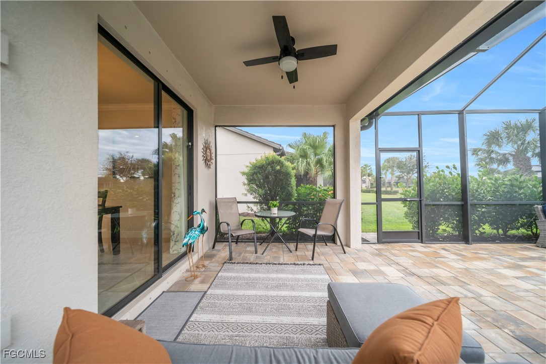 19918 Beverly Park Road Estero, FL 33928 - Photo 27 of 46 a living room with a large window