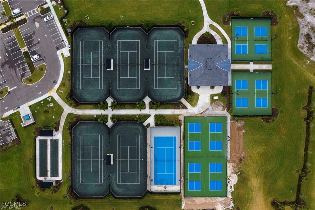 19918 Beverly Park Road Estero, FL 33928 - Photo 39 of 46 a view of a brick building with many windows