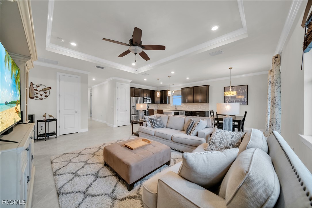 19918 Beverly Park Road Estero, FL 33928 - Photo 4 of 46 a living room with furniture and a wooden floor