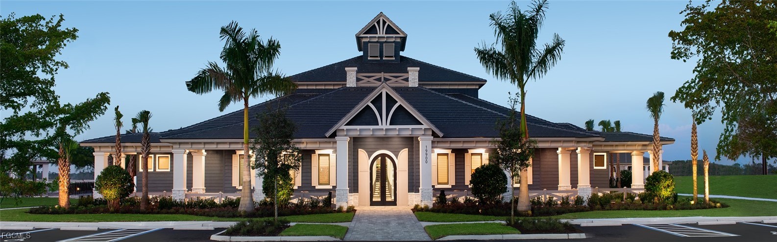 19918 Beverly Park Road Estero, FL 33928 - Photo 41 of 46 a front view of a house with a yard