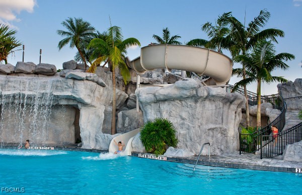 19918 Beverly Park Road Estero, FL 33928 - Photo 45 of 46 a couple of palm trees in front of house