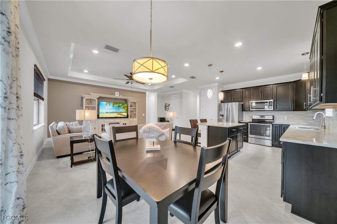 19918 Beverly Park Road Estero, FL 33928 - Photo 8 of 46 a view of a dining area with furniture