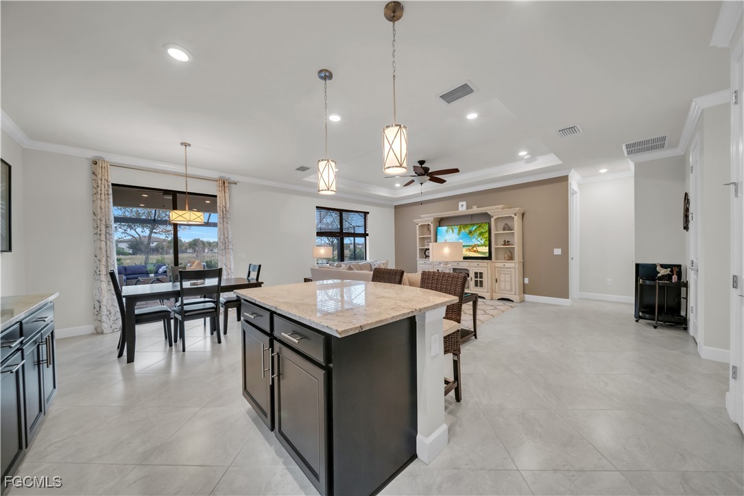19918 Beverly Park Road Estero, FL 33928 - Photo 10 of 46 a kitchen with a table and chairs in it