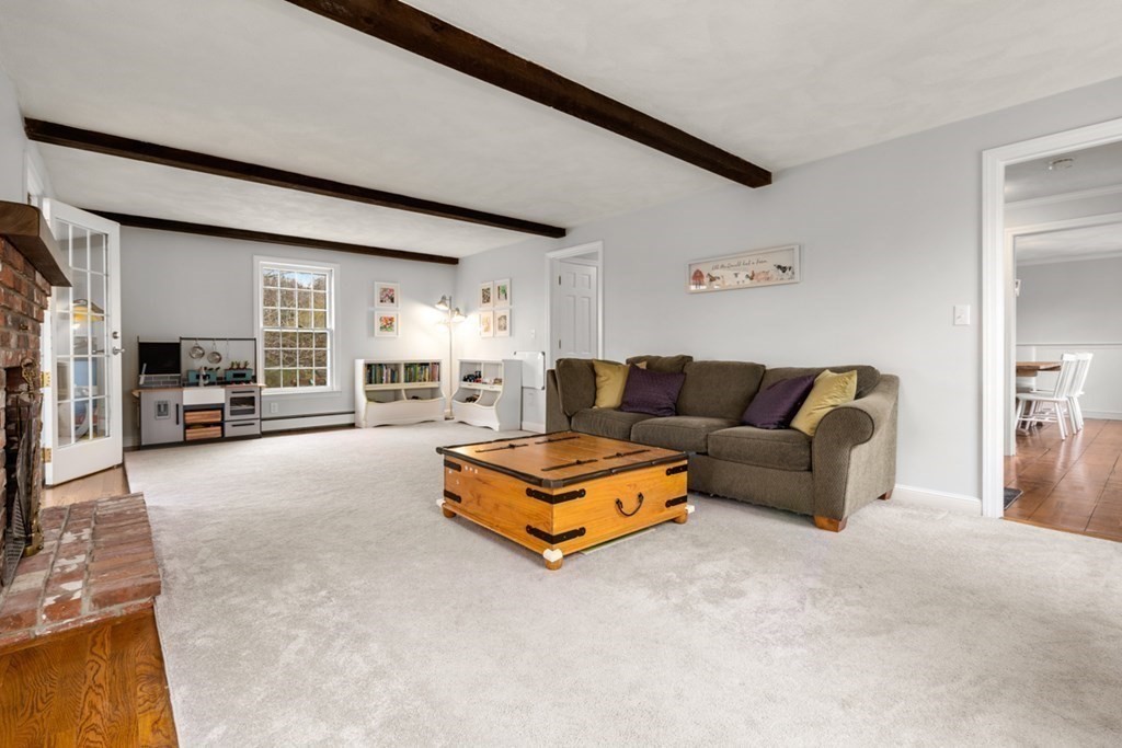 1091 Bay Road Hamilton, MA 01982 - Photo 16 of 40 a living room with furniture and a couch