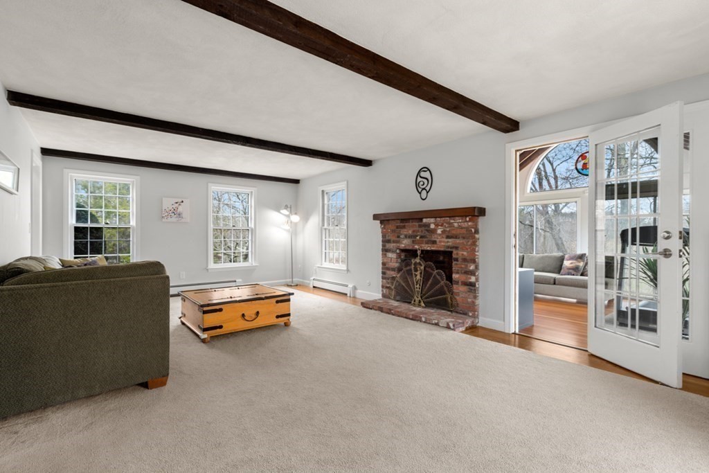 1091 Bay Road Hamilton, MA 01982 - Photo 18 of 40 a room with furniture and a fireplace