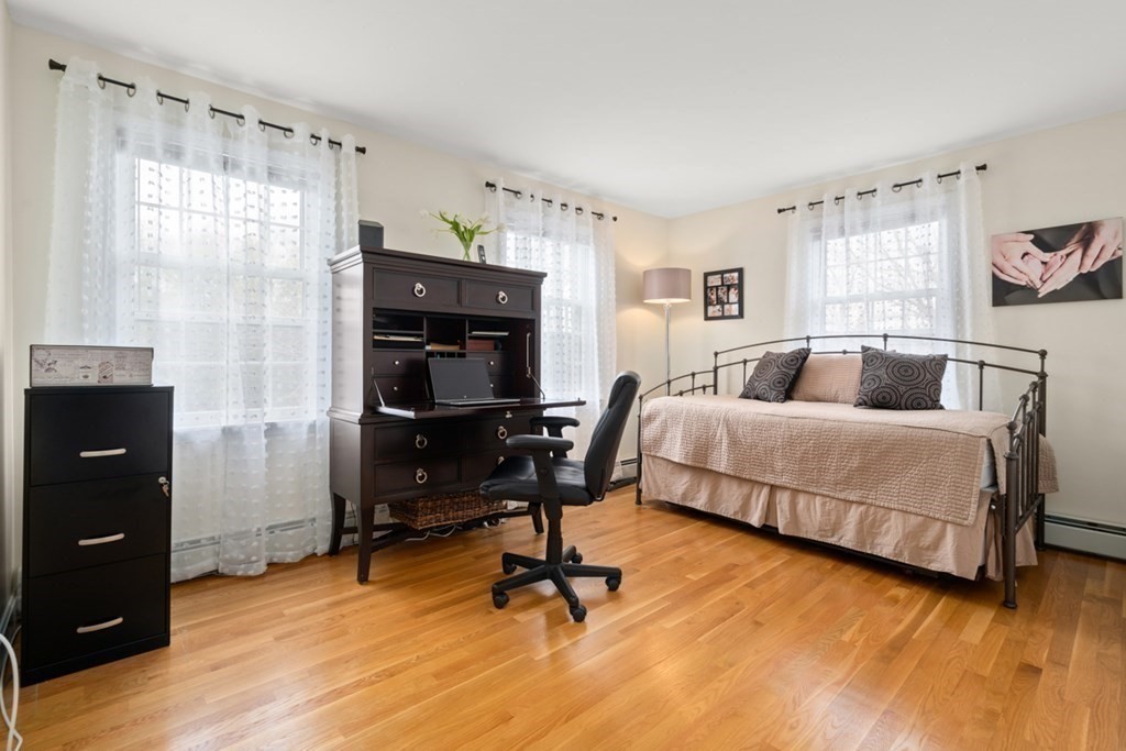 1091 Bay Road Hamilton, MA 01982 - Photo 29 of 40 a bedroom with a bed and wooden floor
