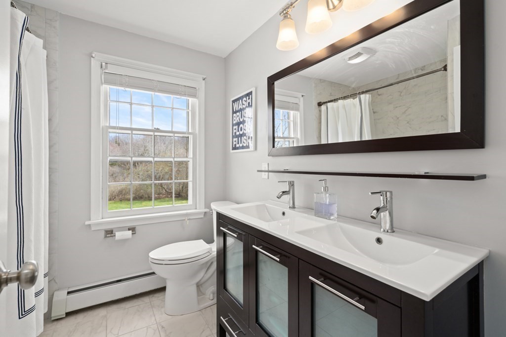 1091 Bay Road Hamilton, MA 01982 - Photo 30 of 40 a bathroom with a sink and a mirror