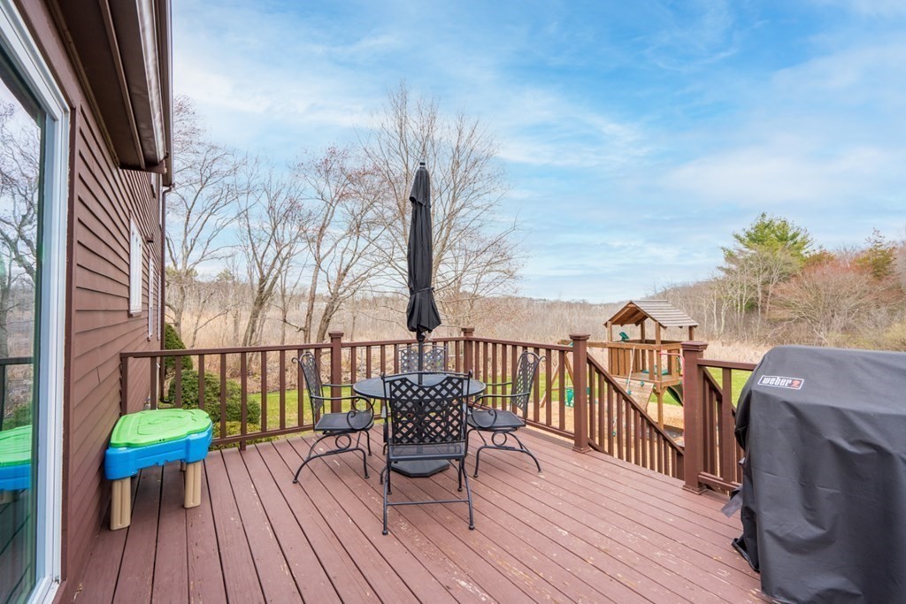 1091 Bay Road Hamilton, MA 01982 - Photo 32 of 40 a balcony with wooden floor table and chairs