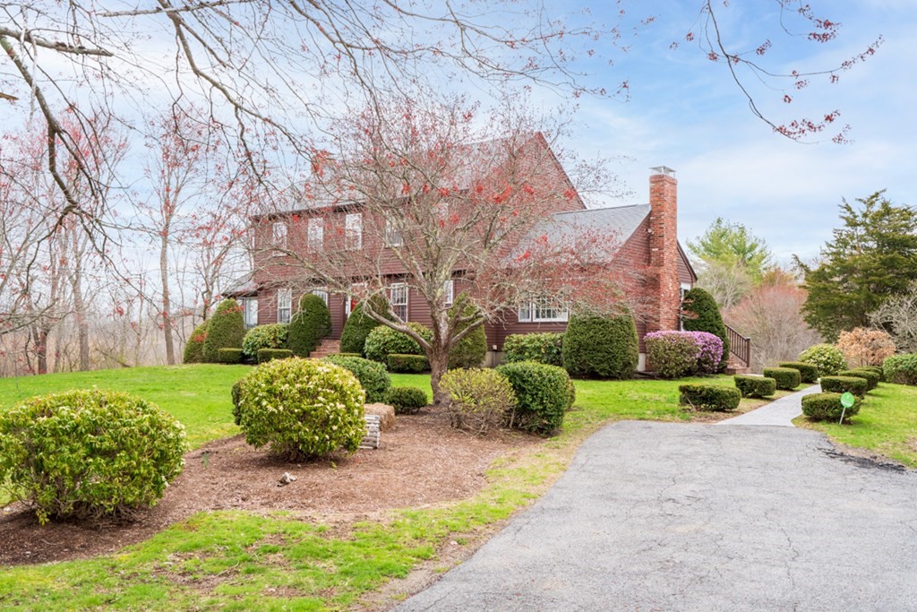 1091 Bay Road Hamilton, MA 01982 - Photo 4 of 40 a front view of a house with garden and trees
