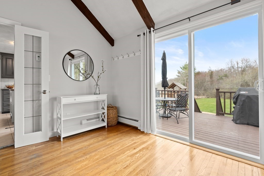 1091 Bay Road Hamilton, MA 01982 - Photo 8 of 40 a view of a hallway with wooden floor and windows