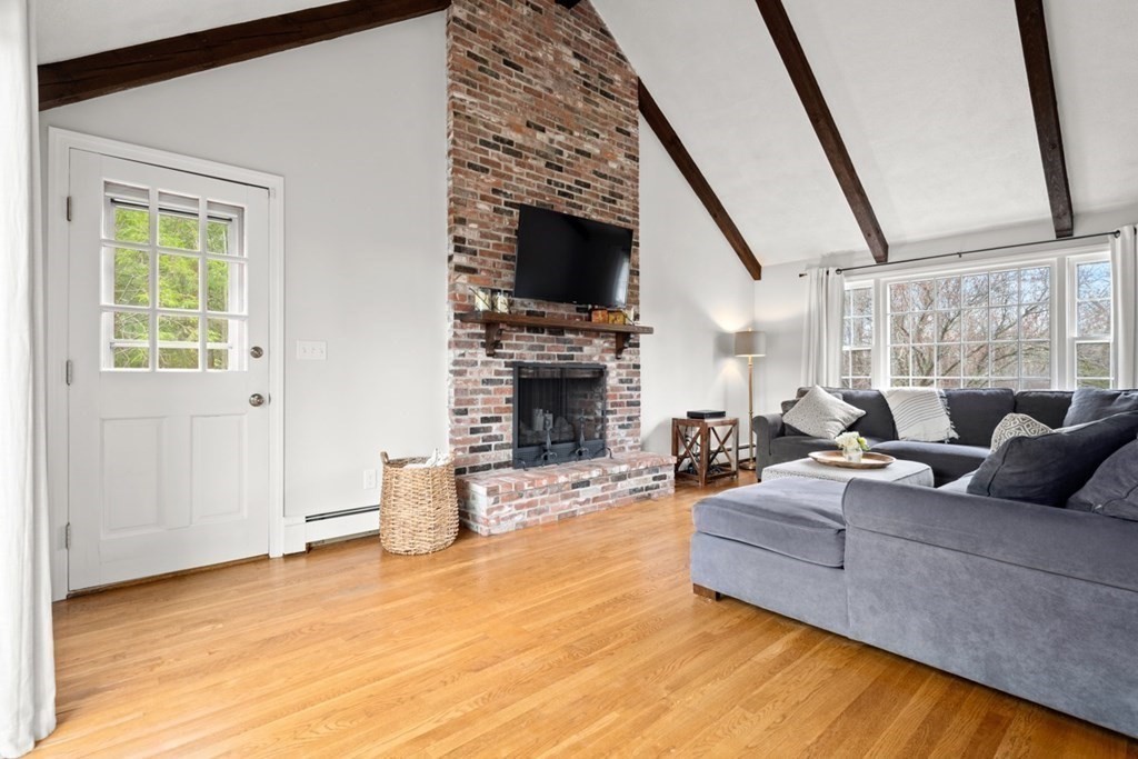 1091 Bay Road Hamilton, MA 01982 - Photo 9 of 40 a living room with furniture and a fireplace