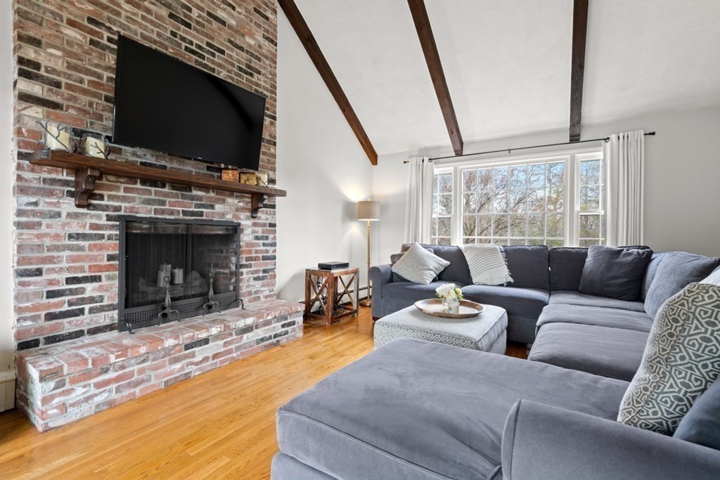 1091 Bay Road Hamilton, MA 01982 - Photo 10 of 40 a living room with furniture and a fireplace