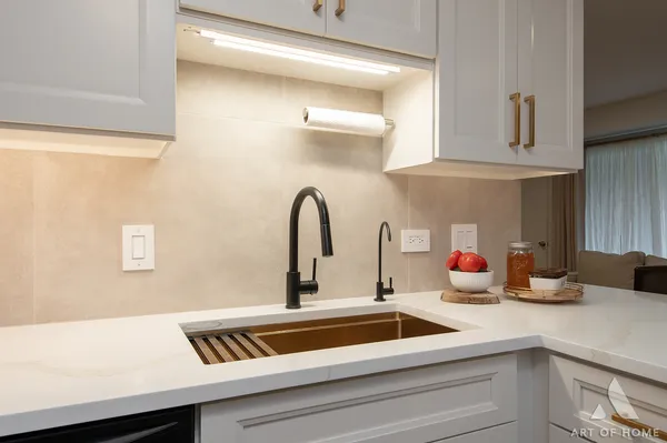 a kitchen with a sink and cabinets