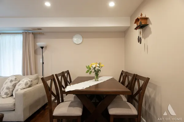 a view of a dining room with furniture and wooden floor