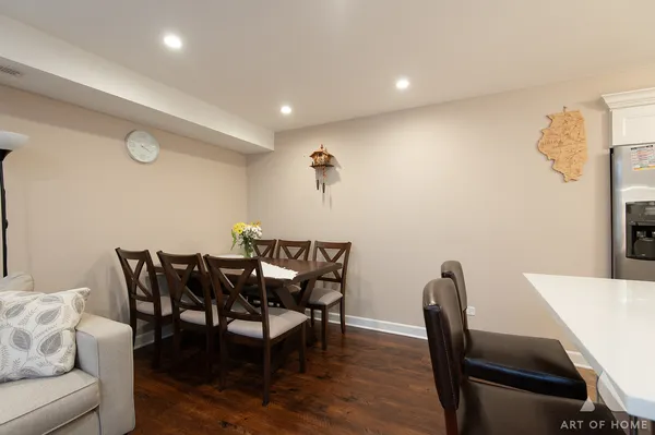 a view of a dining room with furniture and wooden floor