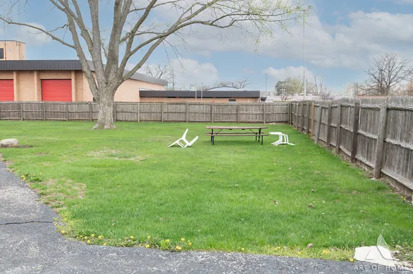 a view of yard with swimming pool having outdoor seating
